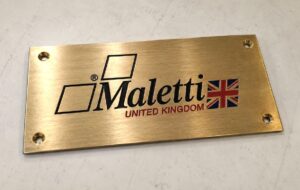 Custom engraved brass plaque for London office.