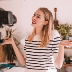 a woman represting that of a beauty influencer in front of a camera