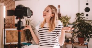 a woman represting that of a beauty influencer in front of a camera