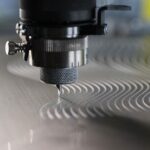 a machine engraving a label